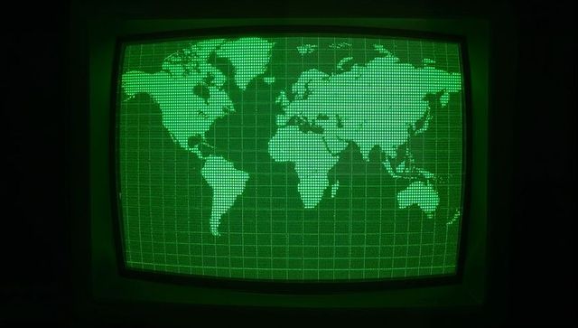 Retro crt display with green world map in technological environment