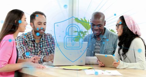 Diverse Team Collaborating on Laptop with Digital Security Icon