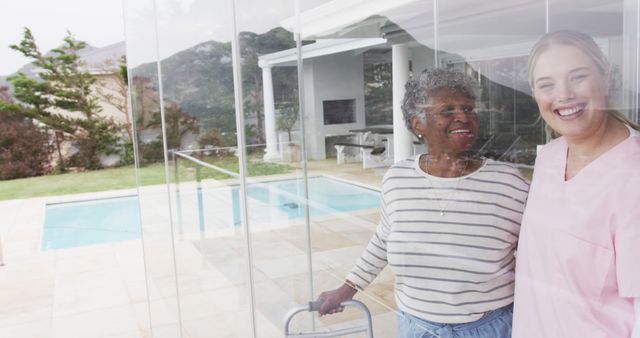 Elderly Woman with Caregiver Enjoying Time Together by the Pool - Download Free Stock Images Pikwizard.com