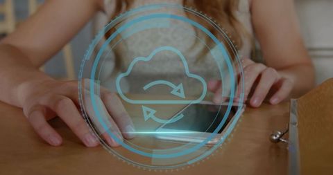 Young woman tapping tablet with cloud sync hologram for remote work and productivity