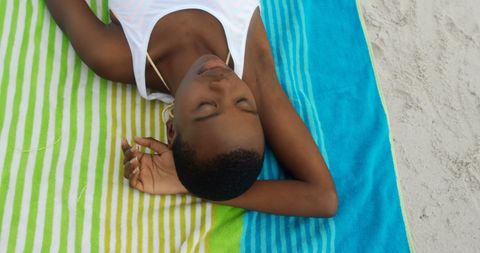Peaceful Young Woman Relaxing on Beach Towel - Download Free Stock Images Pikwizard.com