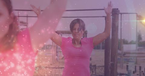 Women Exercising on Obstacle Course with Digital Light Effects