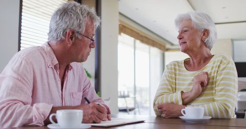 Senior Couple Discussing Finances at Home - Download Free Stock Images Pikwizard.com