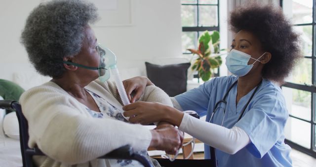 Healthcare Worker Assisting Elderly Patient with Oxygen Mask - Download Free Stock Images Pikwizard.com