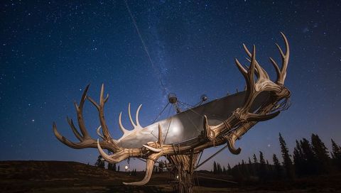 Antler-Wrapped Parabolic Dish under Milky Way, Wooden Horn Sculptures Lighting Night Sky