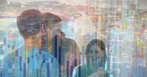 Diverse Business Team Analyzing Financial Data Graphs in Office