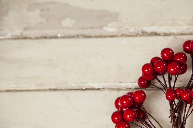 Fake red cherries on a plank - Download Free Stock Photos Pikwizard.com