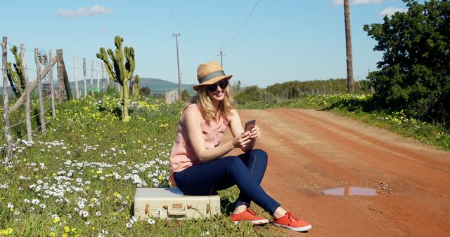 Woman Enjoying Nature While Using Smartphone on Rural Road - Download Free Stock Images Pikwizard.com