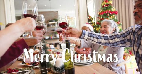 Festive Christmas Celebration with Senior Friends Toasting - Download Free Stock Images Pikwizard.com