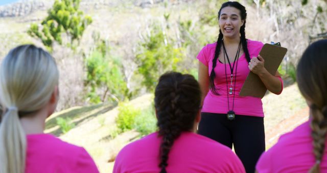 Fitness Coach Leading Outdoor Exercise Session with Team - Download Free Stock Images Pikwizard.com