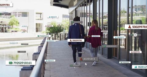 Urban Couple Walking by Waterfront Tagged with Digital Profiles