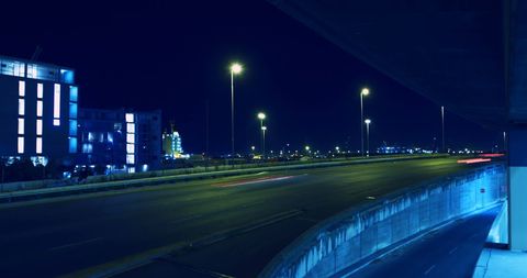 City Highway Night View with Light Trails and Streetlights