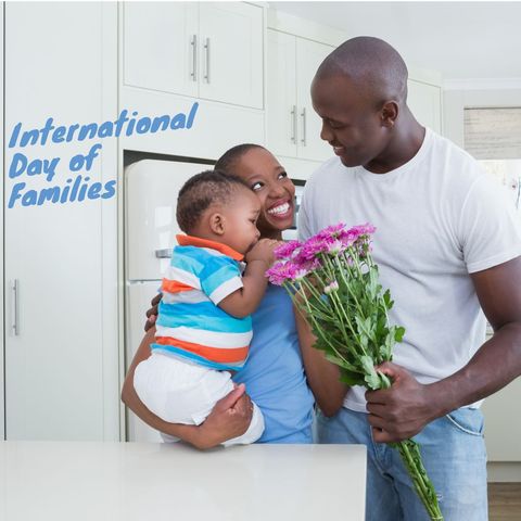 Smiling Family Celebrating International Day of Families with Flowers
