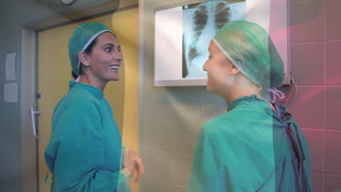 Surgeons Discussing X-ray with French Flag Overlay
