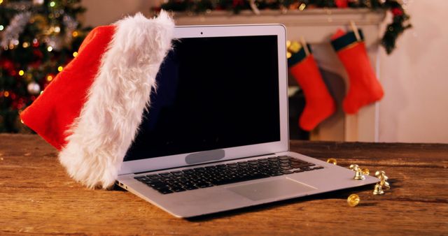Santa hat hanging on laptop at home 4k