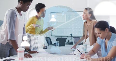 Diverse Team Collaborating on Digital Data Interface in Modern Office