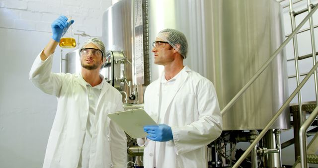 Quality Control Scientists Analyzing Liquid in Industrial Brewery - Download Free Stock Images Pikwizard.com