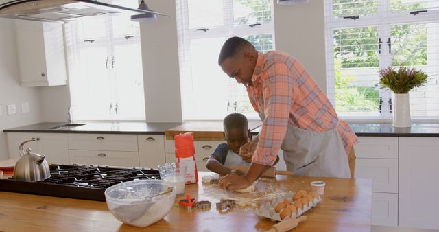Black Father and Son Baking Together Kneading Dough in Cozy Home Kitchen - Download Free Stock Images Pikwizard.com