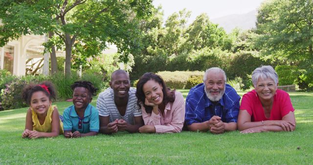 Happy Multi-Generational Family Relaxing Outdoors on Grass - Download Free Stock Images Pikwizard.com