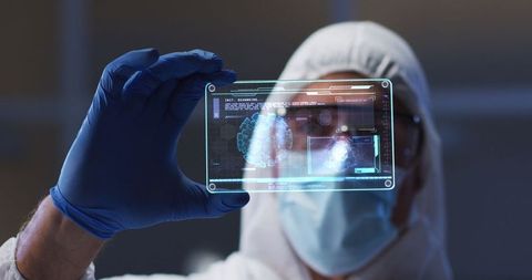 Scientist examining futuristic holographic medical interface