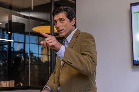 Businessman presenting data in modern boardroom