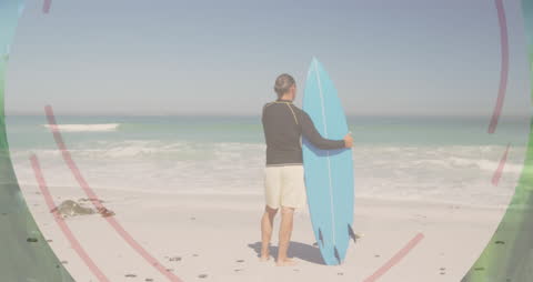 Surfer with Blue Surfboard on Sandy Beach with Copy Space