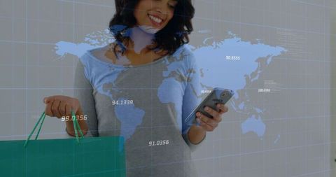 Smiling woman shopping while using smartphone with global data map overlay