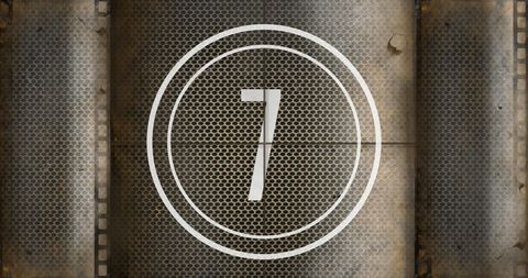 Number seven on textured rusty metallic background