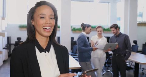 Smiling Professional Working on Smartphone in Modern Office Environment