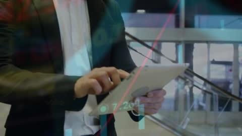 Businessman Analysing Data on Tablet at Airport Terminal