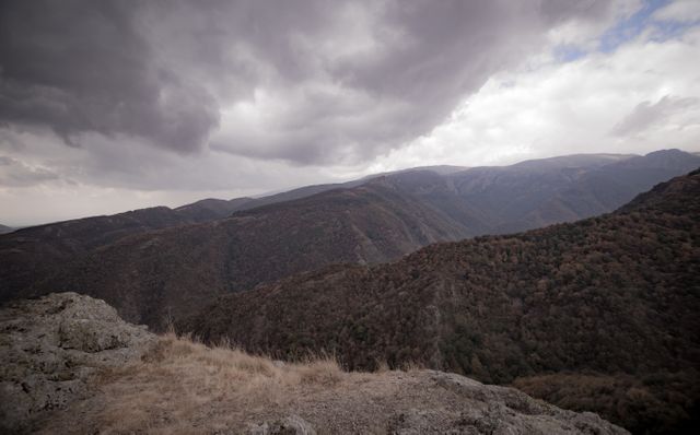 Dramatic Cloudy Sky Over Vast Mountain Range - Download Free Stock Photos Pikwizard.com