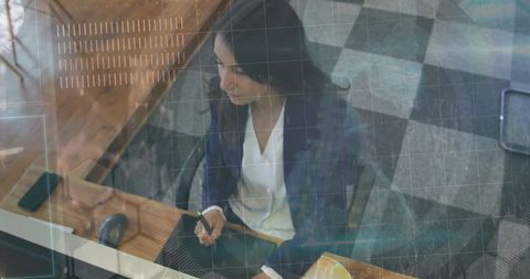 Sophisticated Woman Using Technology for Professional Work in Modern Office