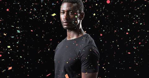 African American Male Athlete Celebrating with Confetti Backdrop