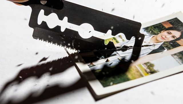 Razor blade cutting portrait print, symbolic breakup and memory destruction concept
