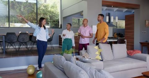 Friends Joyfully Decorating for a Birthday Celebration in Modern Living Room