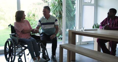 Elderly couple embracing at home symbolizing love and support