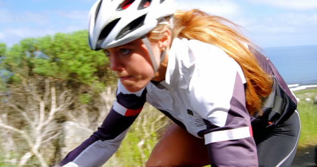 Focused Woman Cyclist Training Outdoors in Nature - Download Free Stock Images Pikwizard.com