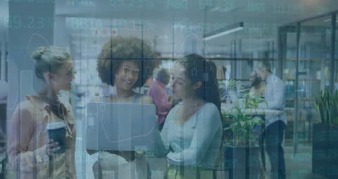 Diverse Team Discussing over Laptop in Modern Office