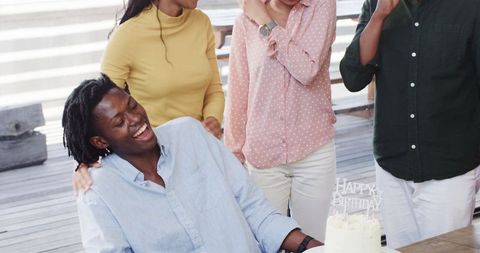 Office birthday celebration with friends and cake