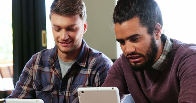 Young Men Collaborating on Digital Project in Modern Workspace - Download Free Stock Images Pikwizard.com