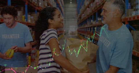 Volunteers Organizing Donations with Digital Data Visualization - Download Free Stock Images Pikwizard.com