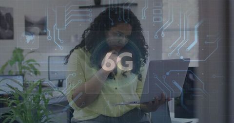 Woman engaging in call while looking at laptop with 6g technology interface