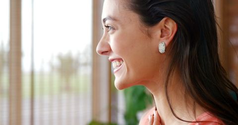 Happy woman enjoying bright day indoors