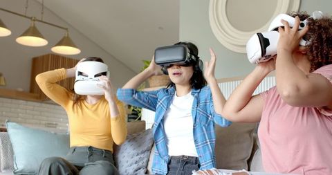 Diverse Female Friends Enjoying VR Gaming at Home