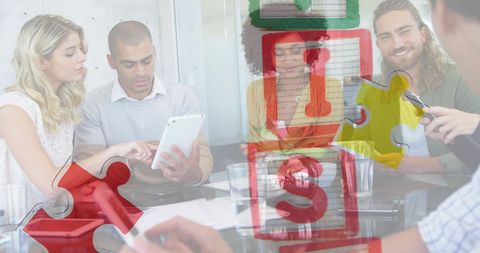 Youthful office team collaborating with tablet displays creative learning focus