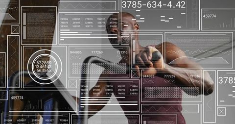 Athlete lifting dumbbell while monitoring live fitness data and performance analytics