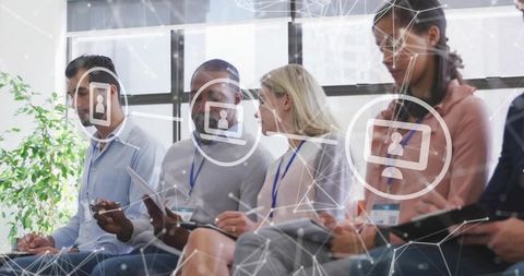 Business Professionals Collaborating with Digital Technology in Meeting