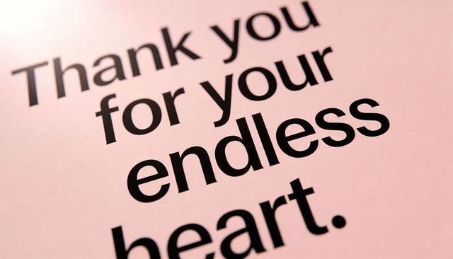 Soft pink thank you card with bold black sans-serif typography for modern gratitude design