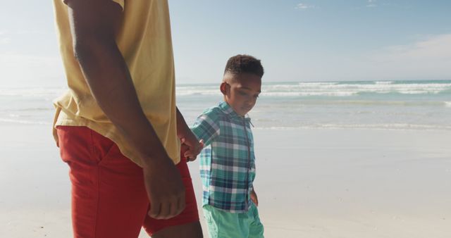 Father and Son Walking on Beach Holding Hands - Download Free Stock Images Pikwizard.com