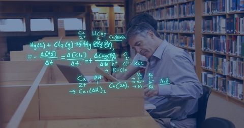 Teacher and Student Collaborating in Library with Digital Overlays